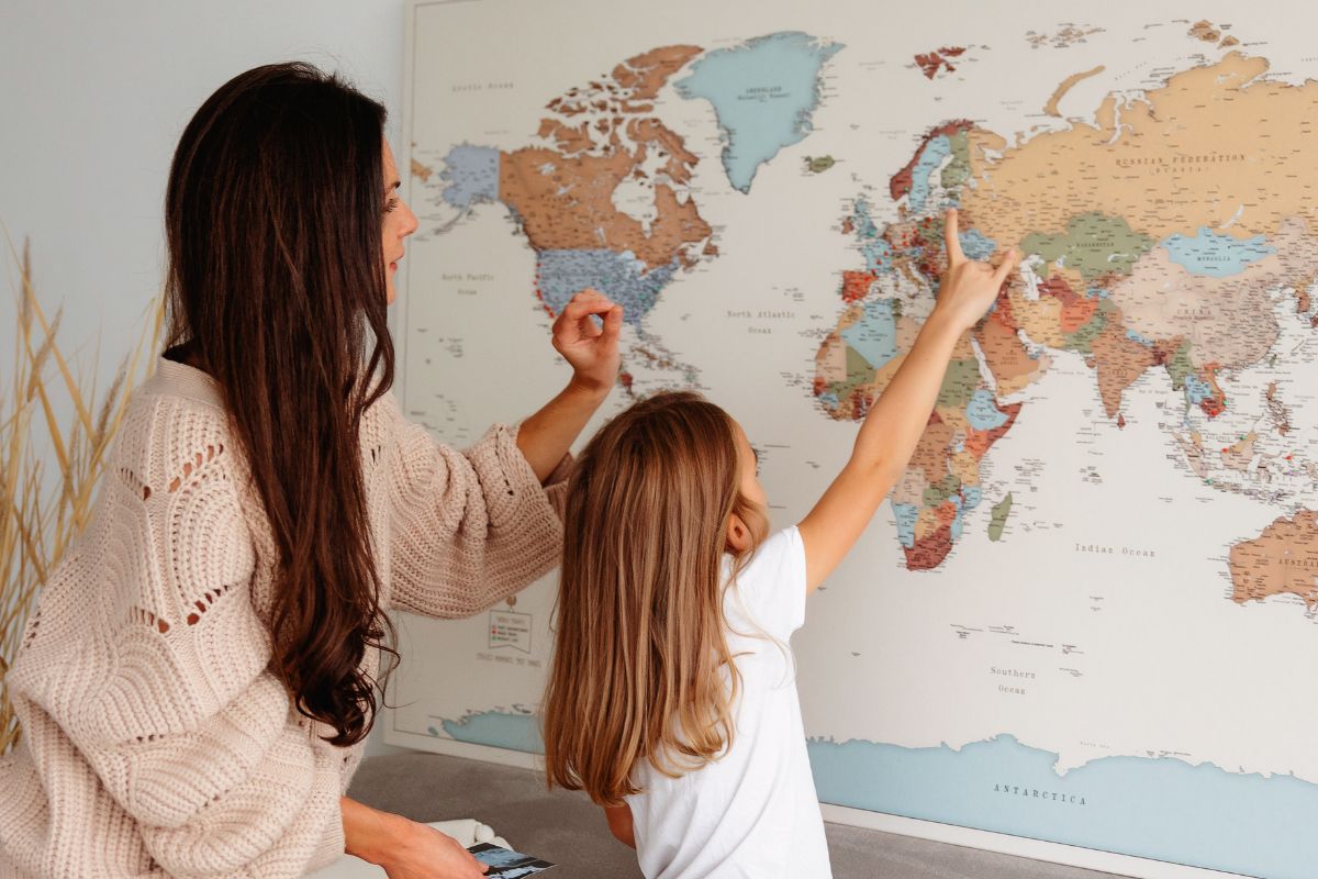 family travel map on canvas with pins