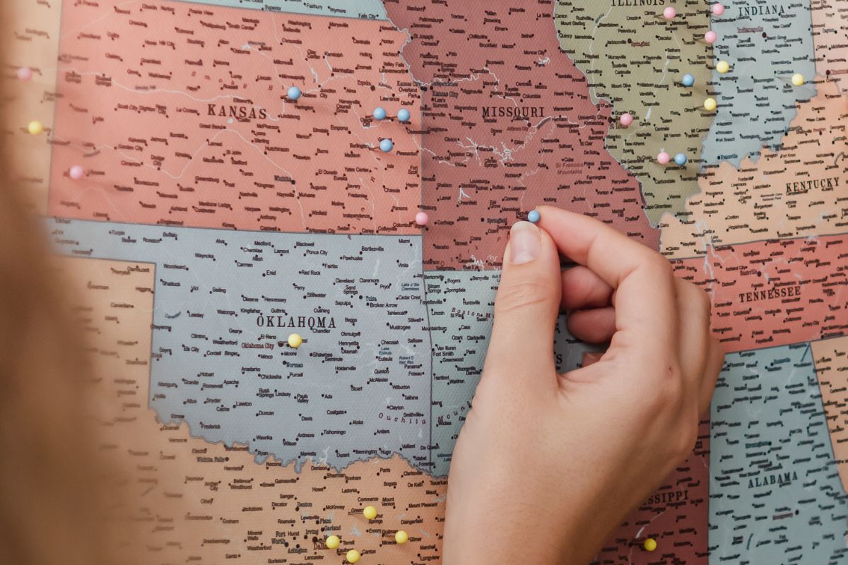 large map of the United States with pin to mark states cities visited