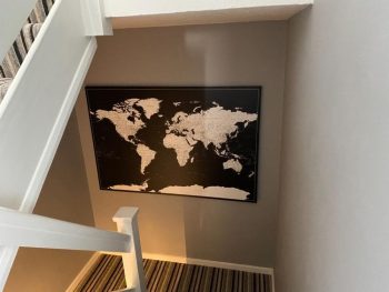 push-pin-world-map-customer-photo-modern-black-hallway