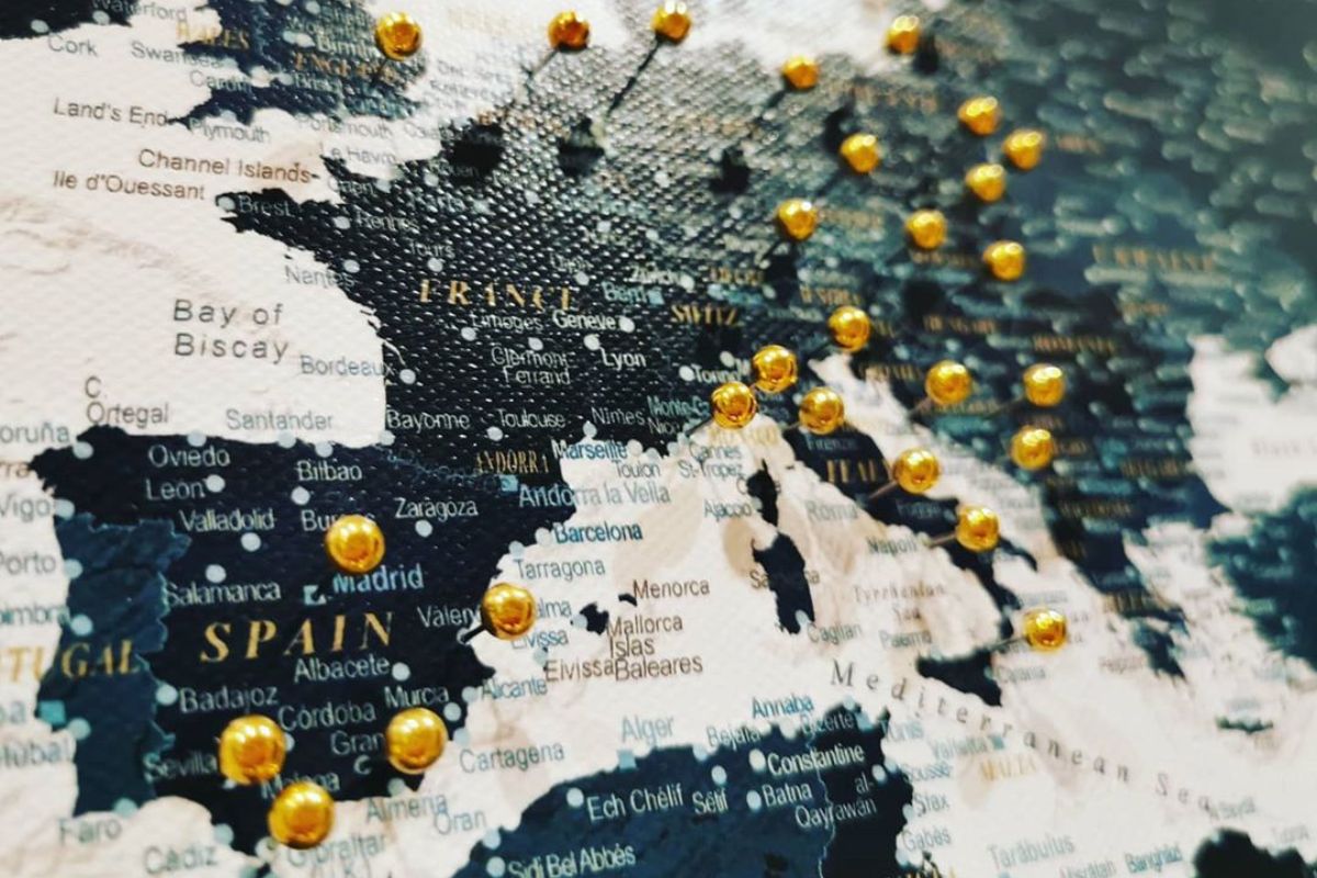 world map canvas wall art with gold pins