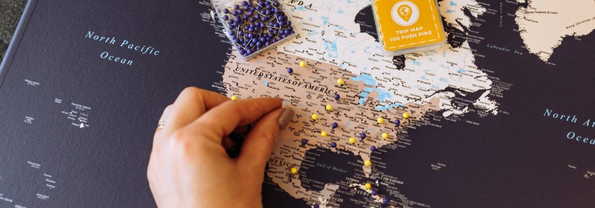 tripmap-pinboard-world-map-with-pins-violet-3p-aspect-ratio-1140-400